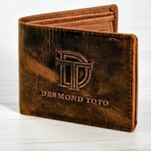 Front view of The Obscure brown distressed leather wallet with debossed Desmond Toto logo.