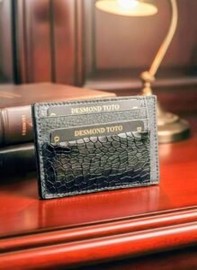 The Executive Midnight Edition black pebbled leather card sleeve with three card slots.